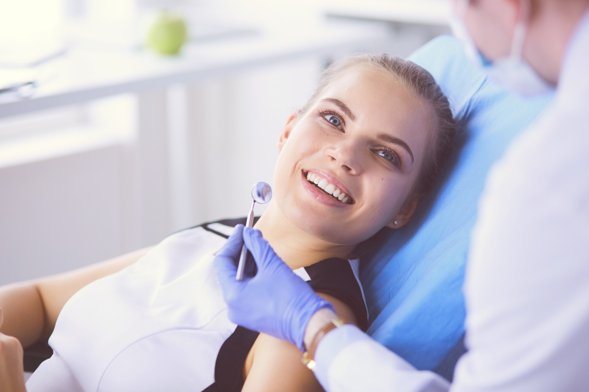 woman at dentist in Vero Beach FL