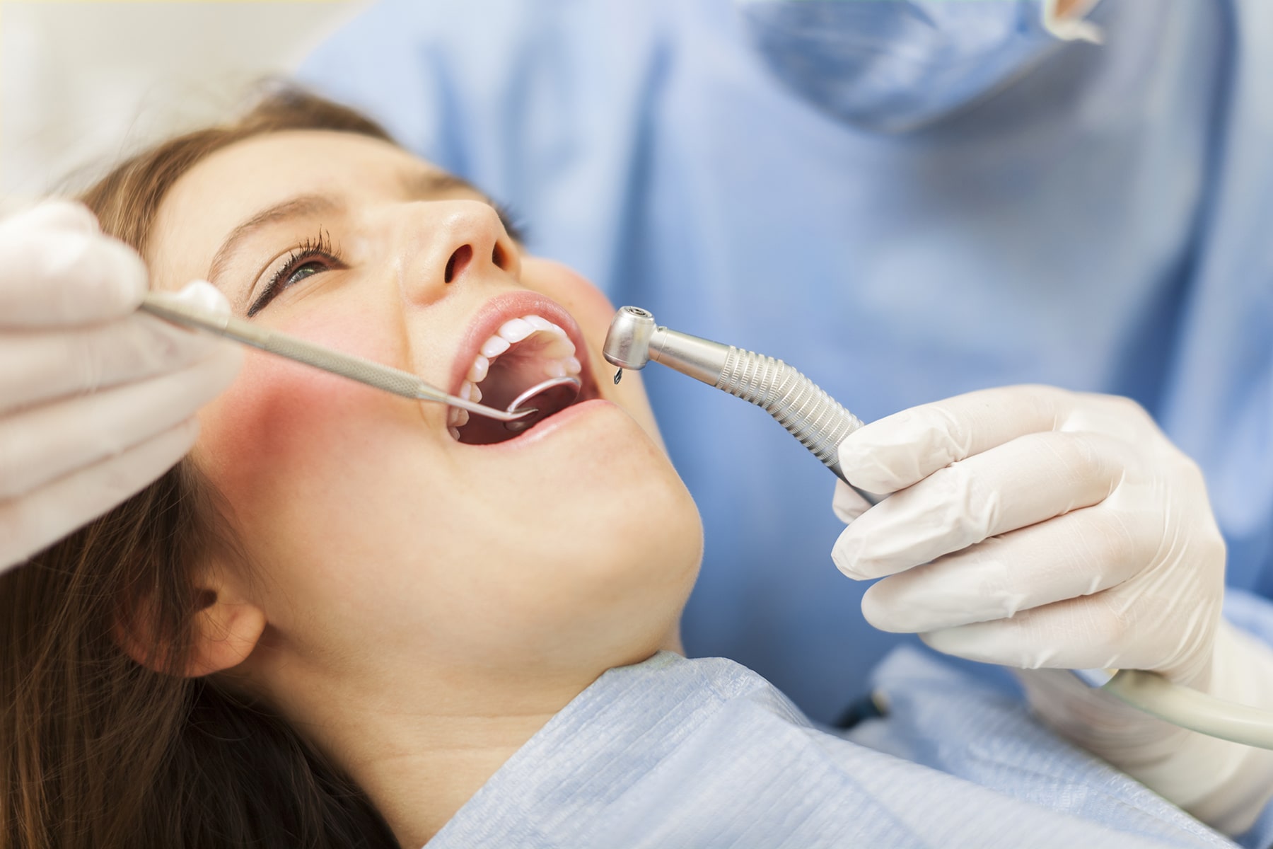 Woman getting composite dental bonding treatment in Vero Beach, FL