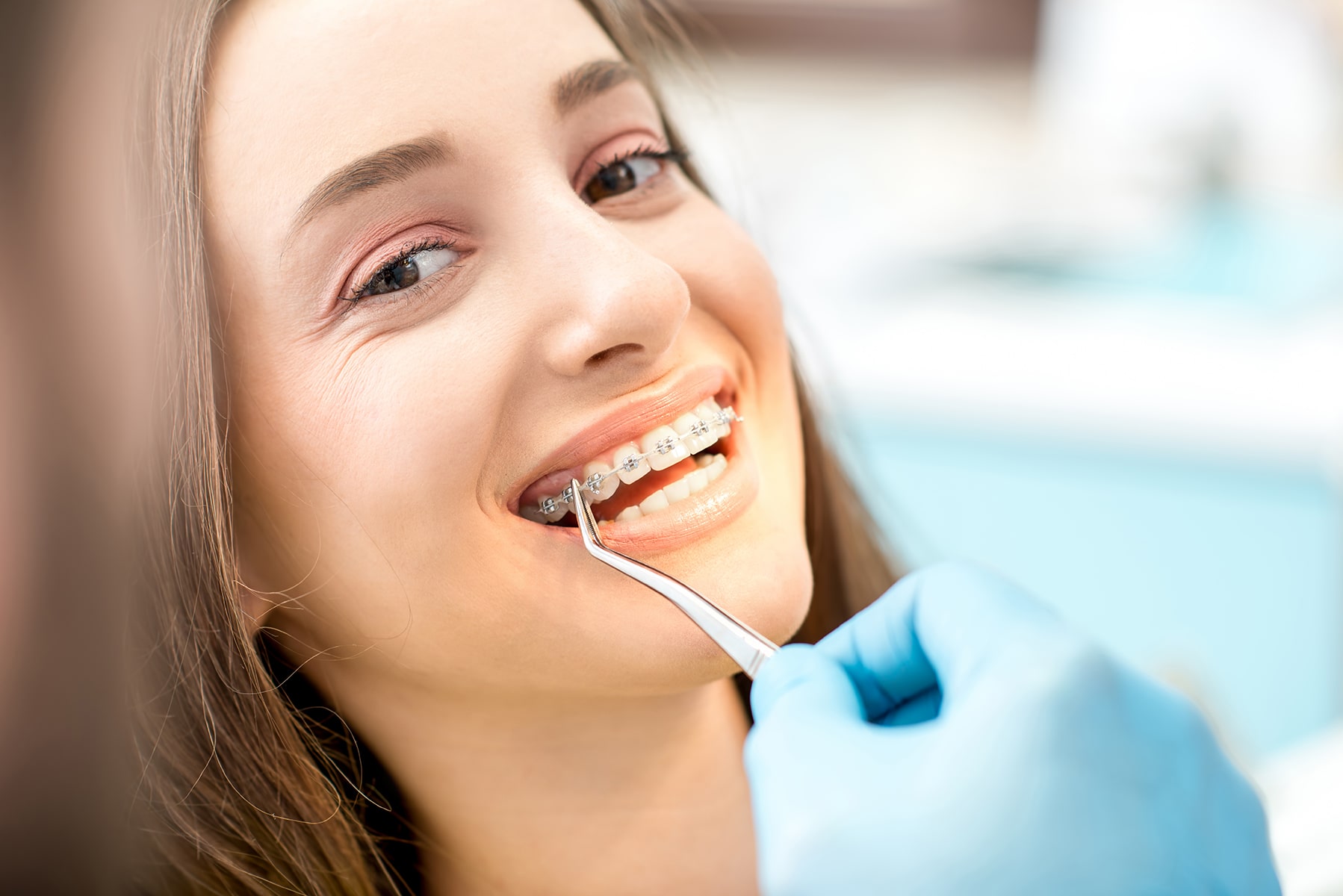 Woman with dental braces in Vero Beach, FL
