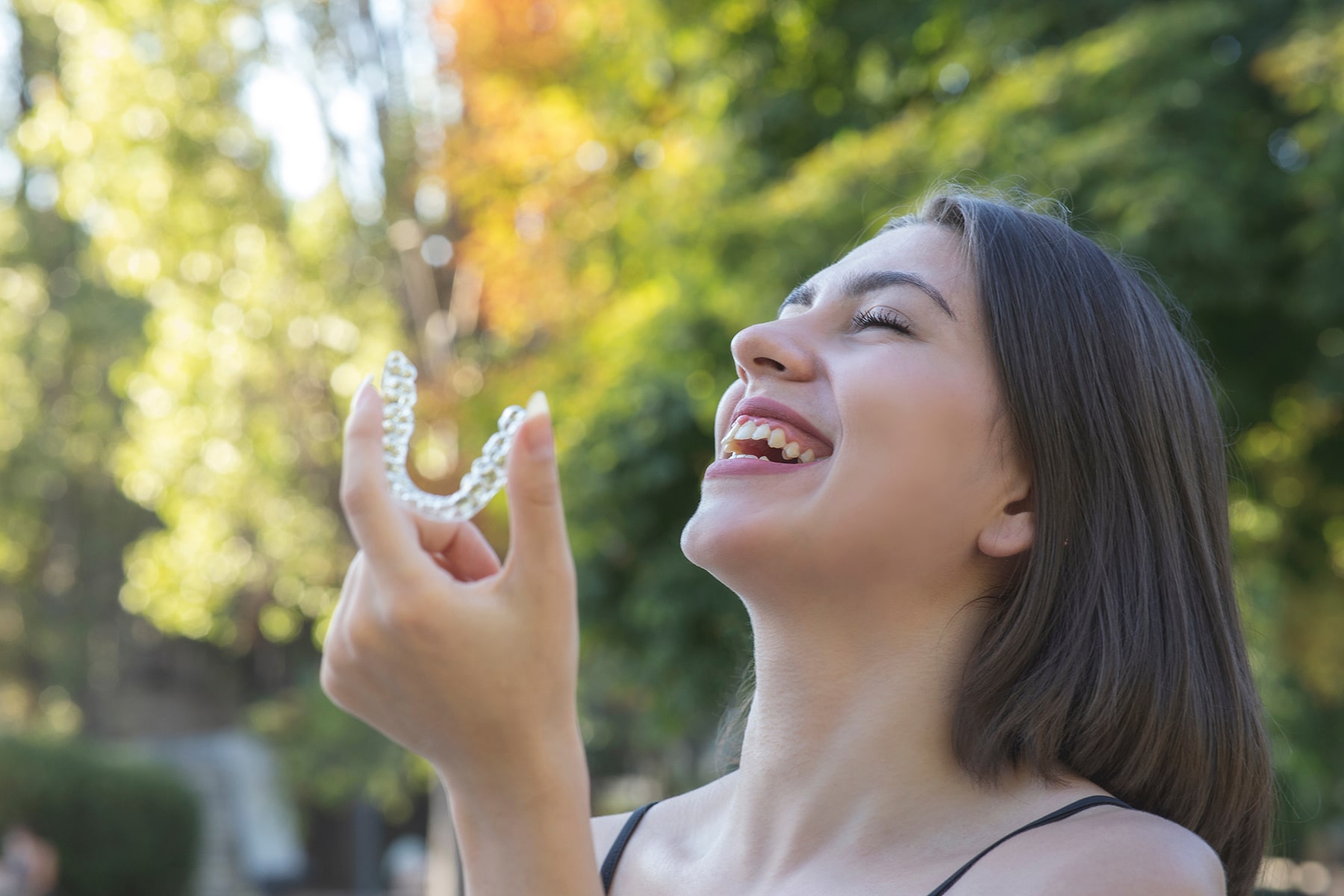 Woman smiling with invialign aligners in Vero Beach, FL