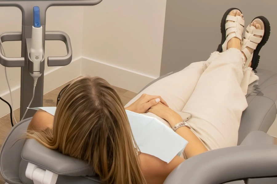 Patient relaxing in a dental chair at Novak Dental in Vero Beach, FL
