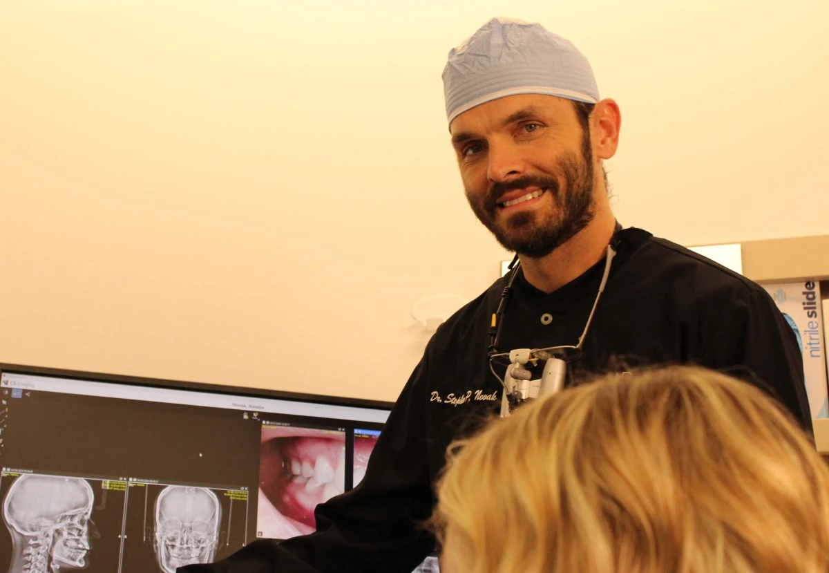 Dentist discussing preventive dental care with a patient in Vero Beach, FL