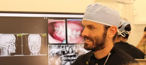 Dentist reviewing X-rays at Novak Dental in Vero Beach, FL