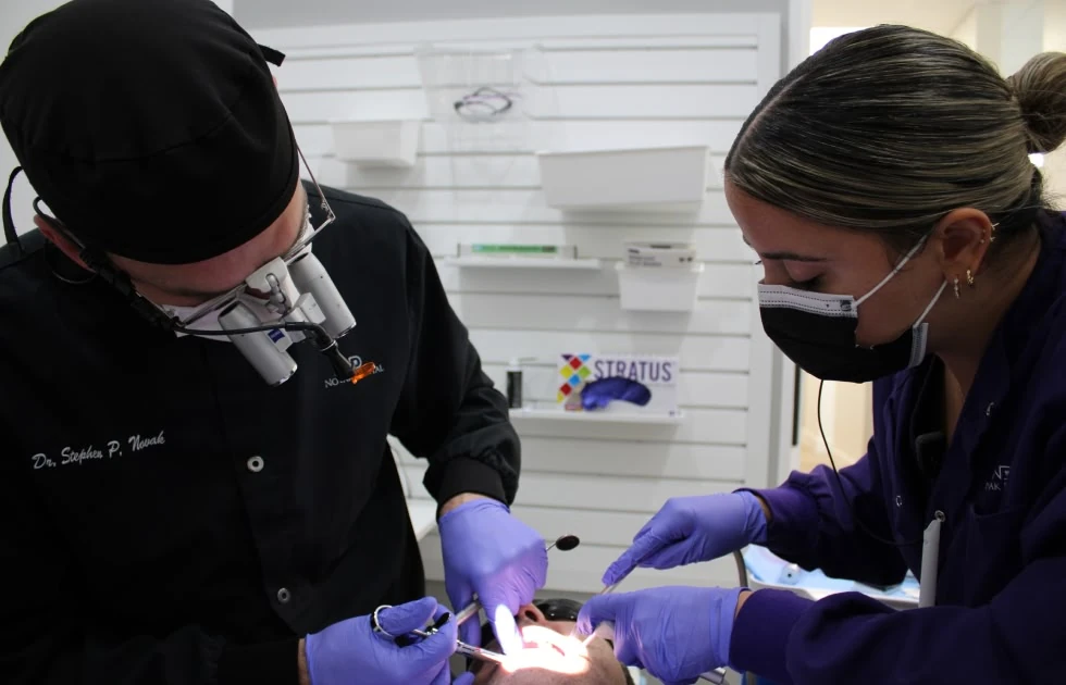 Novak Dental team performing a dental procedure in Vero Beach, FL
